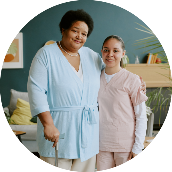 Senior Patient Hugging Young Nurse